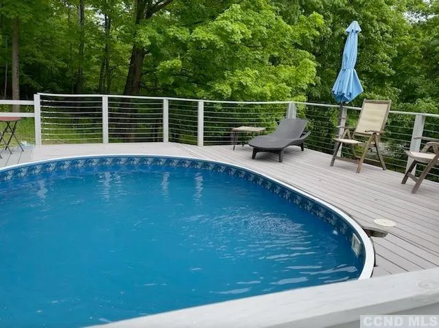a view of a swimming pool with a patio