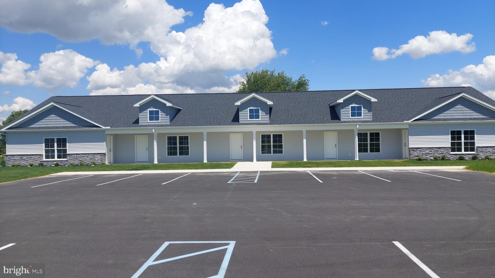 Michaels Way, Unit 2D East New Market, MD 21631 - Photo 1 of 2 a front view of house with yard