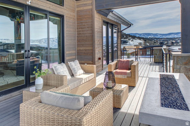 1282 Chimney Rock Road, Unit 344 Heber City, UT 84032 - Photo 15 of 55 Expansive outdoor deck featuring wood-finish flooring and a stone fire pit