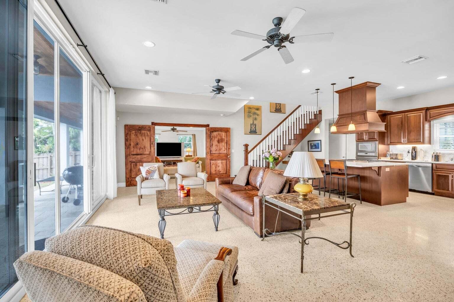 1009 Northwest Terrace Road Stuart, FL 34994 - Photo 11 of 69 a living room with furniture kitchen view and a large window