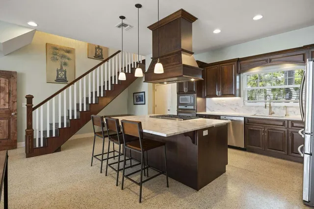 a spacious bedroom with a bed and a large window