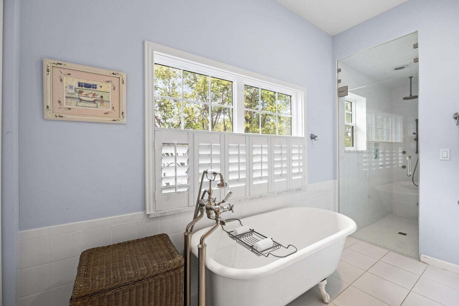 1009 Northwest Terrace Road Stuart, FL 34994 - Photo 32 of 69 a bathroom with a tub and a shower