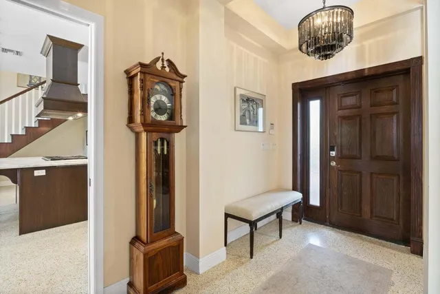 a kitchen with stainless steel appliances granite countertop a stove and a refrigerator