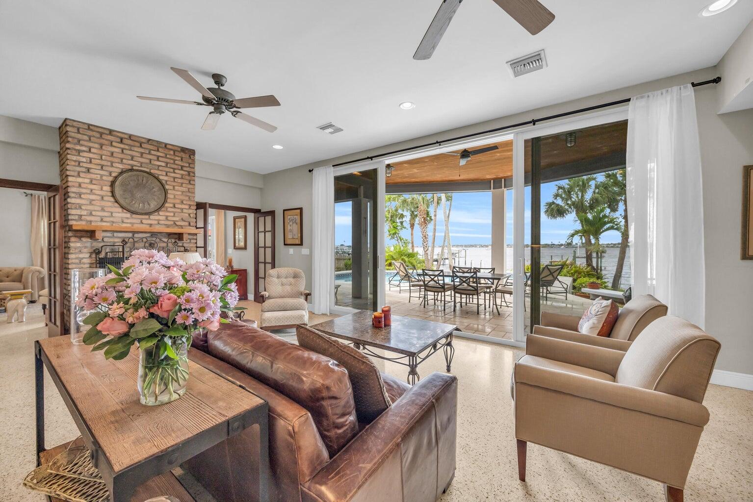 1009 Northwest Terrace Road Stuart, FL 34994 - Photo 8 of 69 a living room with furniture and a large window