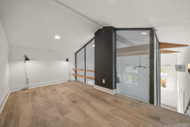 a view of an empty room with a window