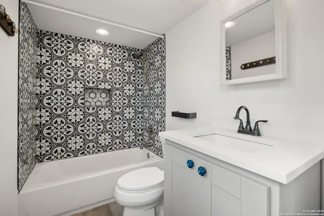 a large white kitchen with a window