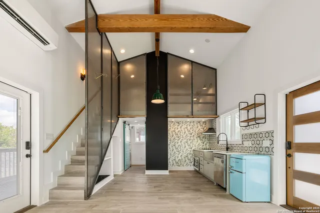 a view of a walk in closet and wooden floor
