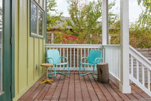 a view of balcony with wooden floor