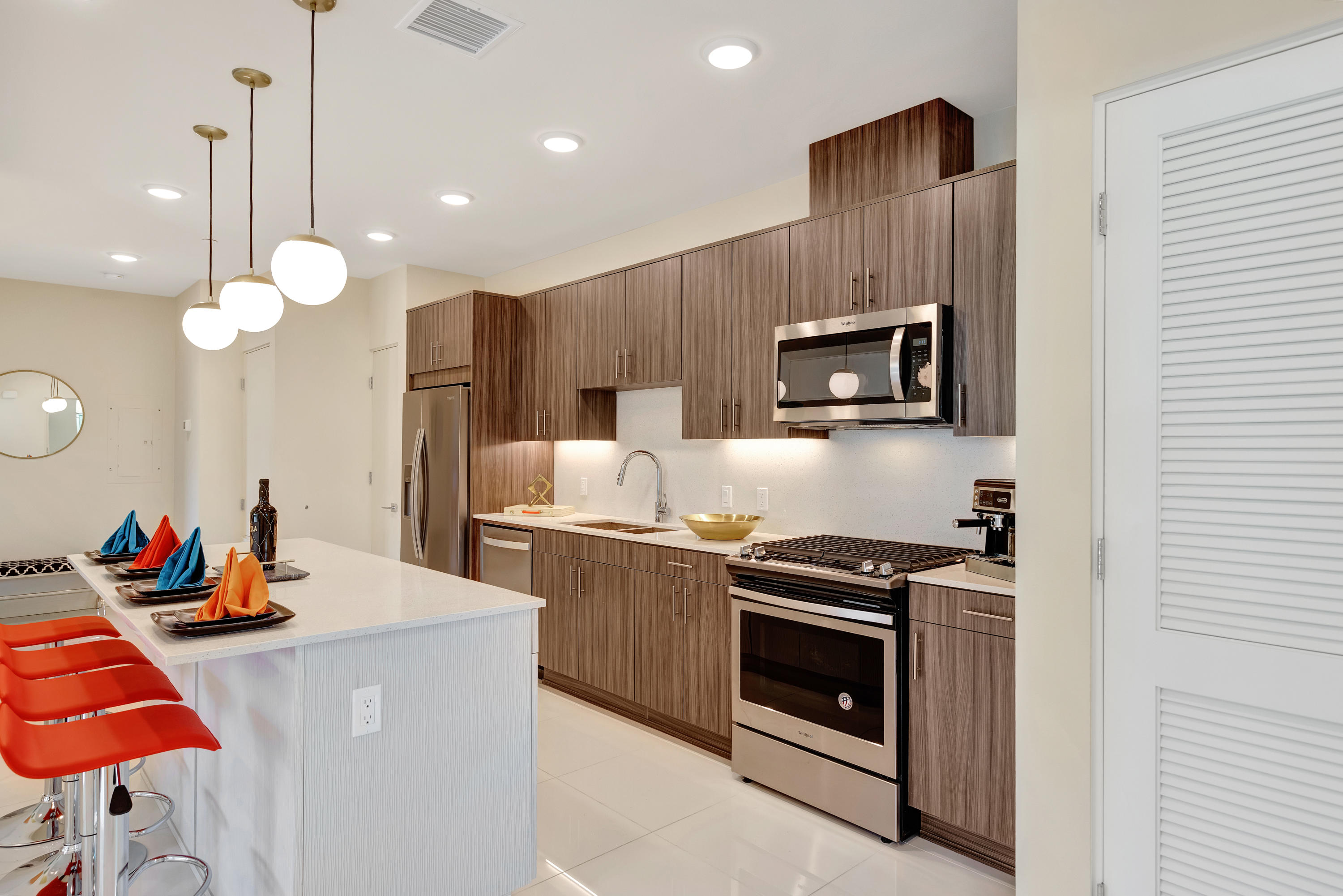 161 The River Palm Springs, CA 92262 - Photo 20 of 46 a kitchen with stainless steel appliances a stove a sink and a refrigerator