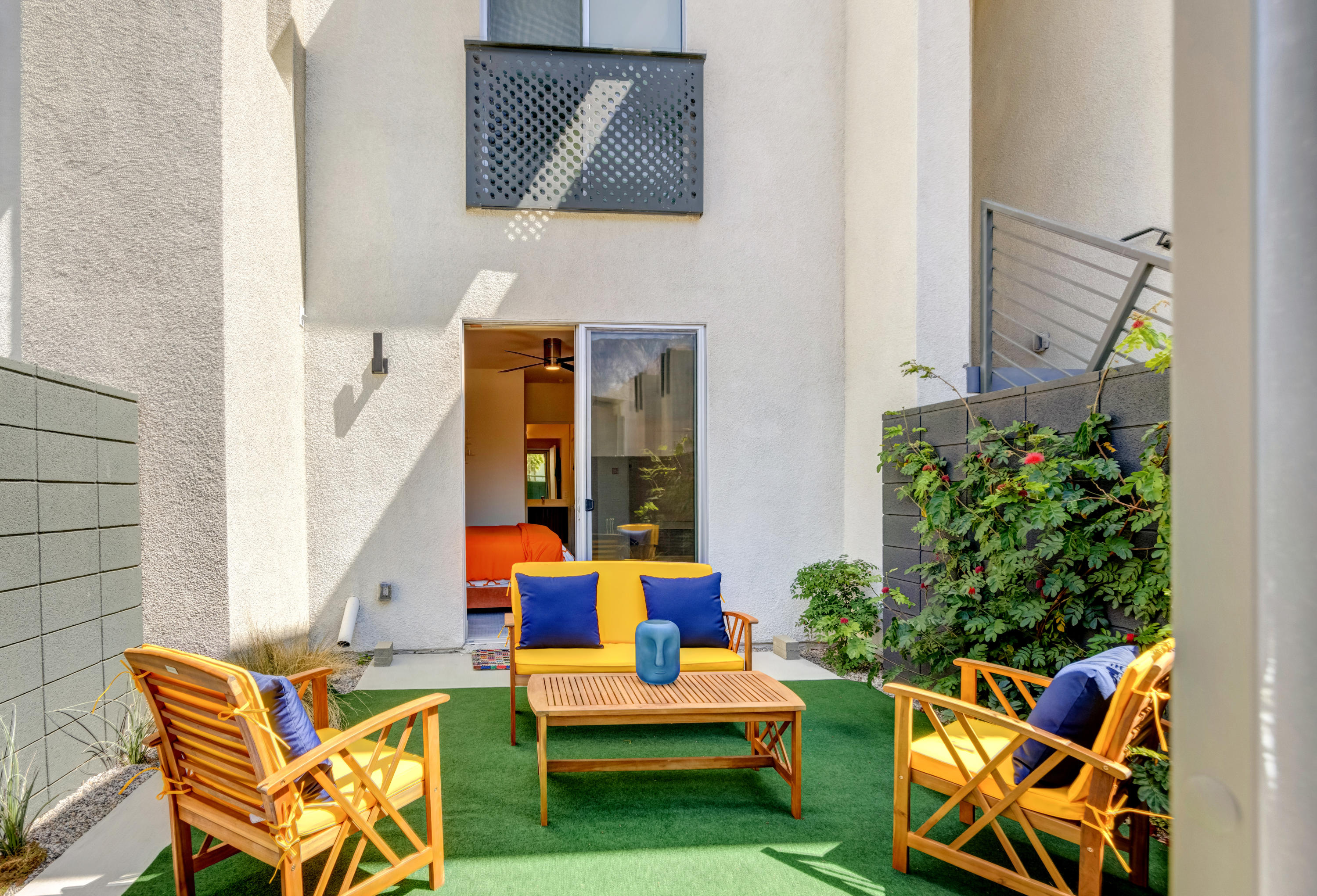 161 The River Palm Springs, CA 92262 - Photo 3 of 46 an outdoor sitting area with chairs and potted plants