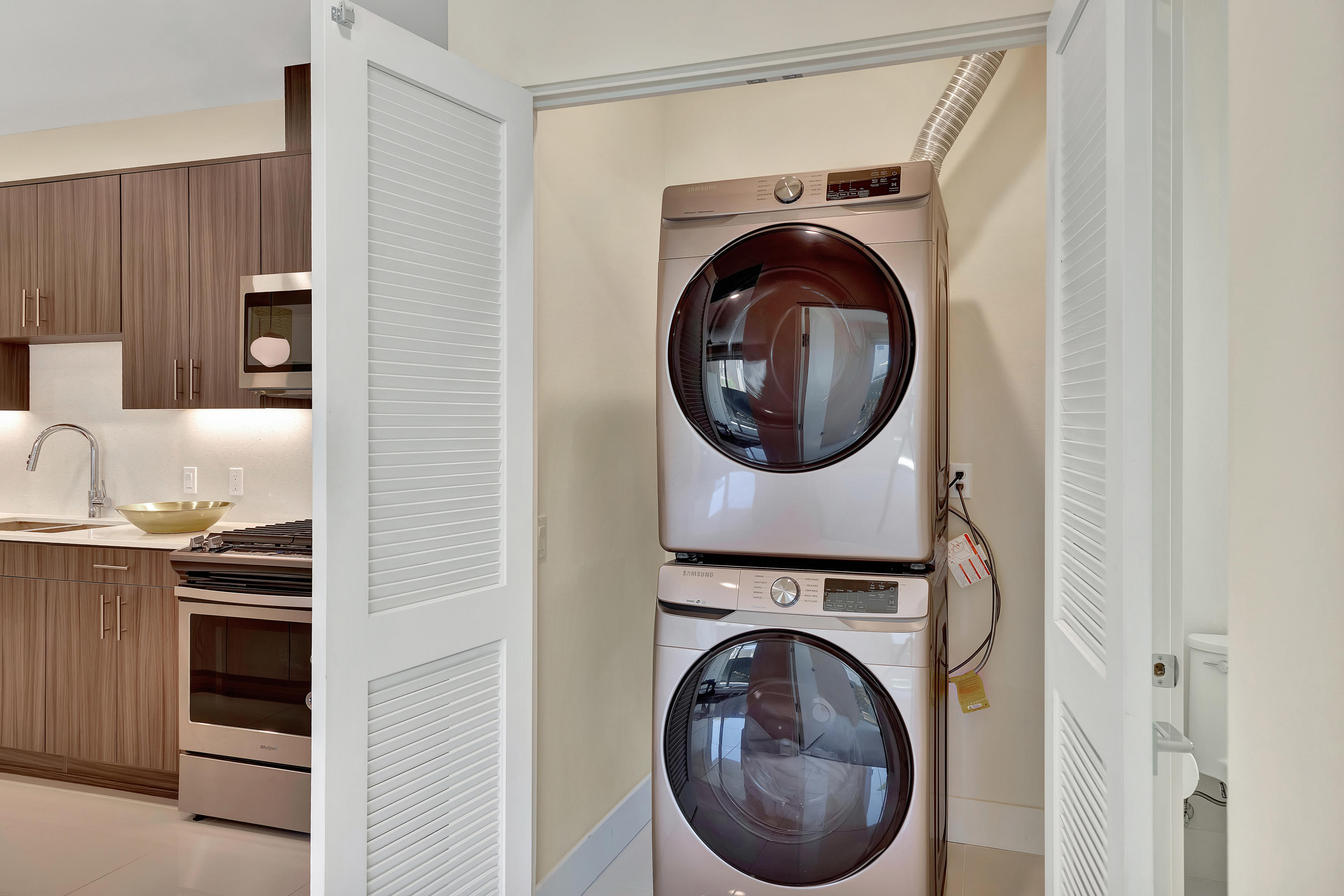 161 The River Palm Springs, CA 92262 - Photo 22 of 46 a view of a hallway with washer and dryer