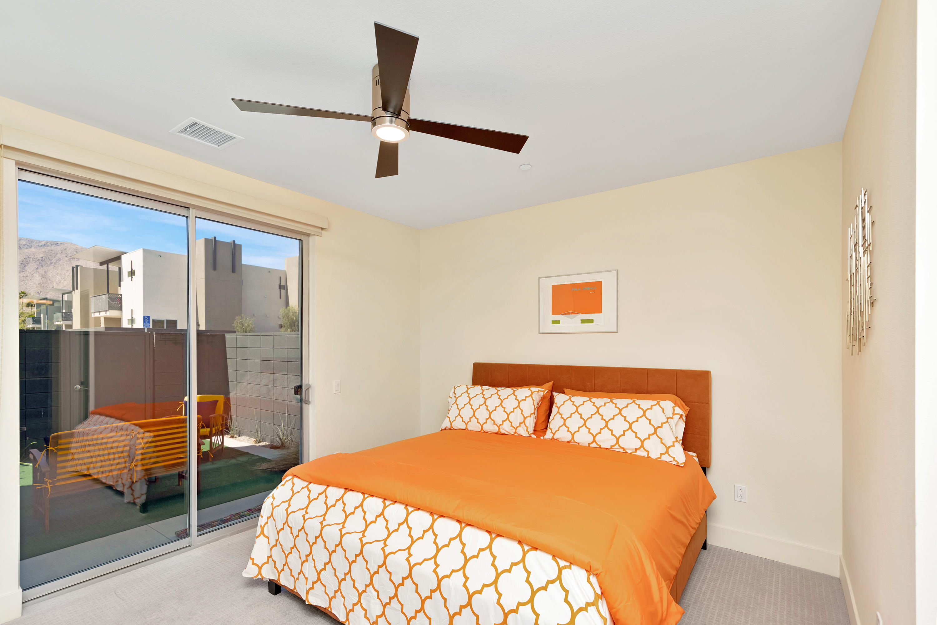 161 The River Palm Springs, CA 92262 - Photo 24 of 46 a bedroom with a bed and glass walk in closet