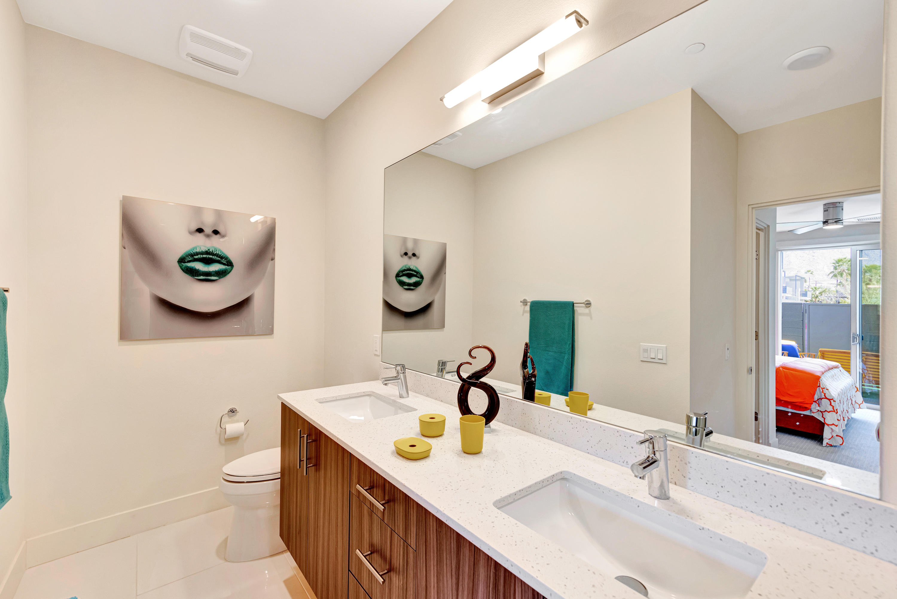 161 The River Palm Springs, CA 92262 - Photo 27 of 46 a bathroom with a toilet sink and mirror