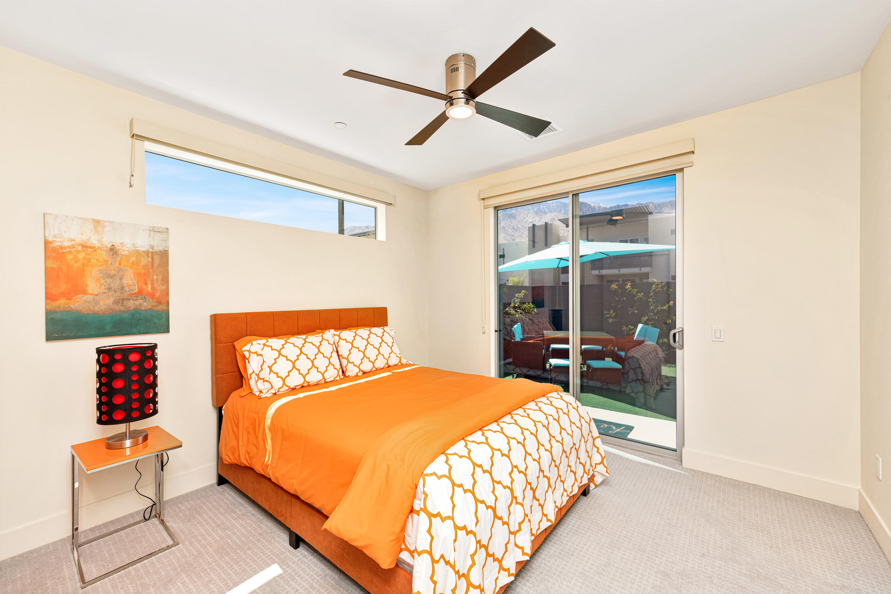 161 The River Palm Springs, CA 92262 - Photo 30 of 46 a bedroom with a bed and a large window