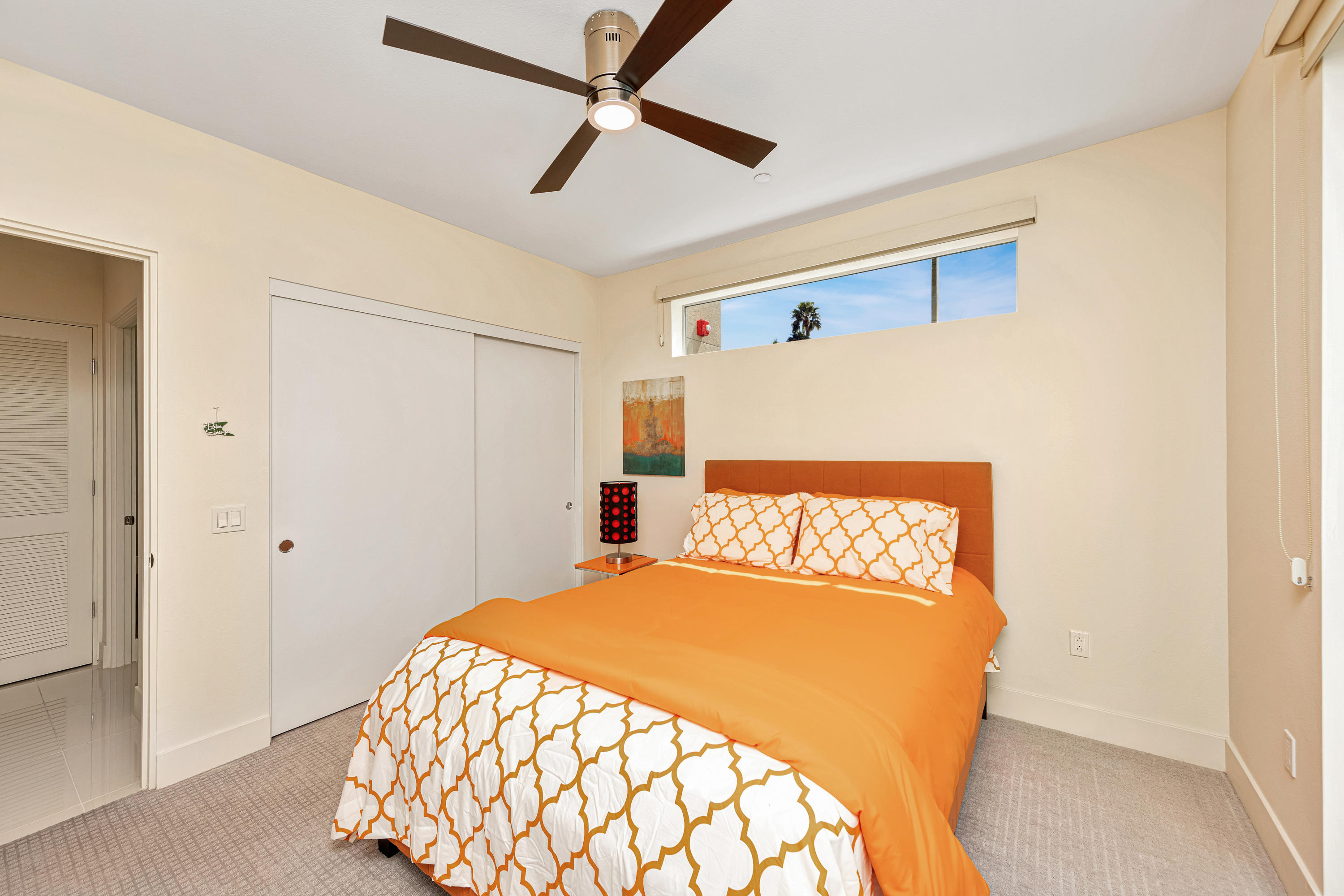 161 The River Palm Springs, CA 92262 - Photo 31 of 46 a bedroom with a bed and a painting on the wall