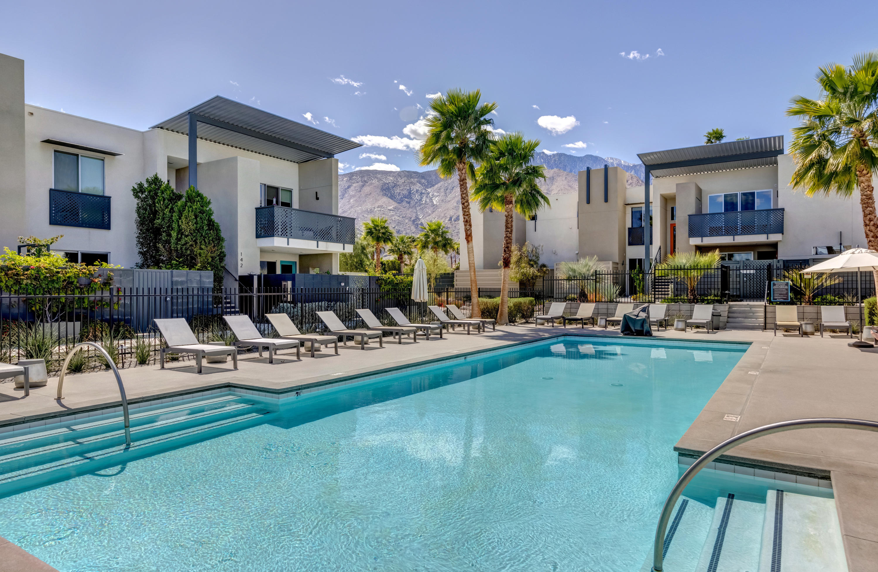 161 The River Palm Springs, CA 92262 - Photo 40 of 46 a view of a house with swimming pool and sitting area
