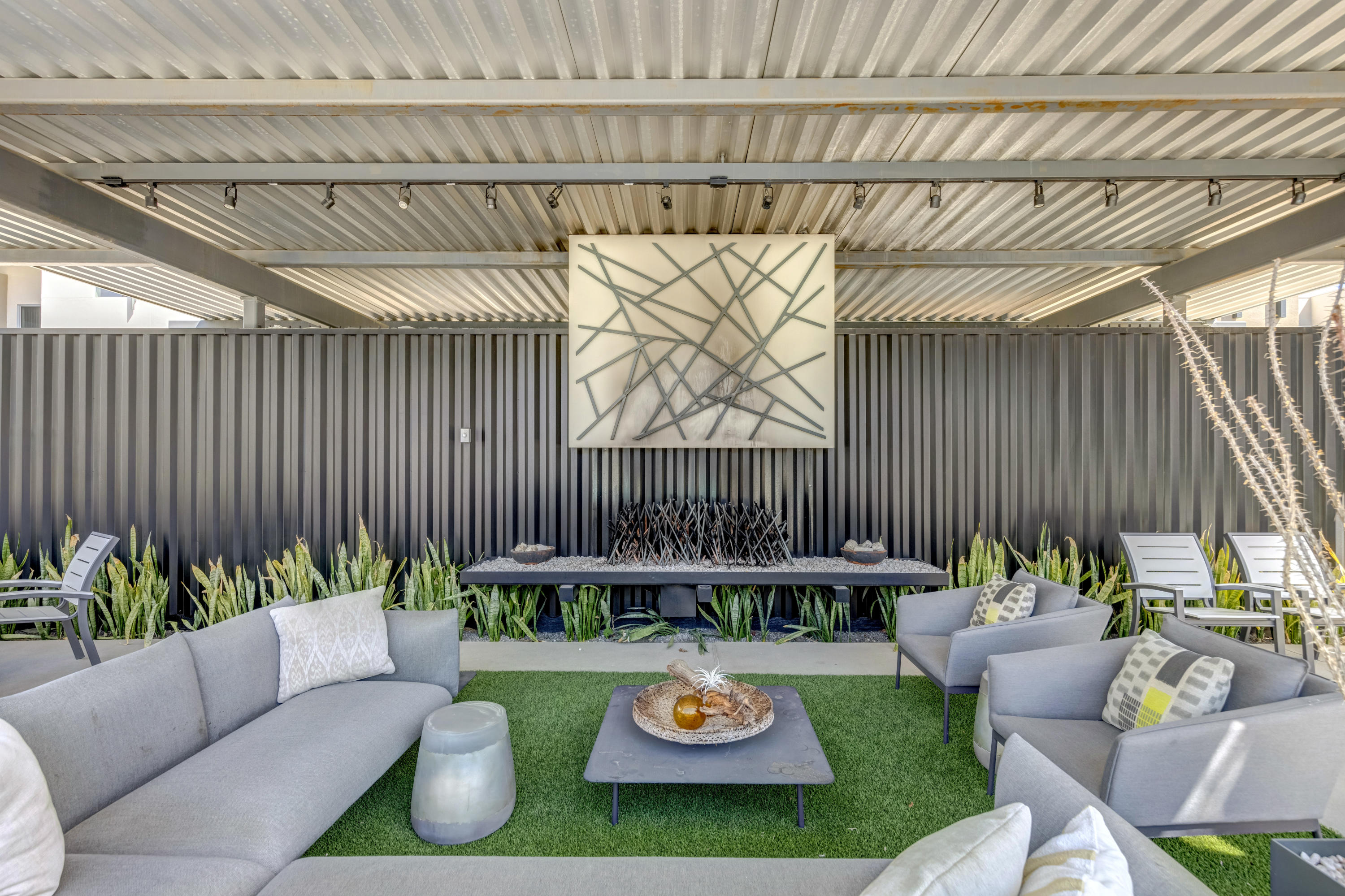 161 The River Palm Springs, CA 92262 - Photo 44 of 46 a view of a patio with couches table and chairs and potted plants