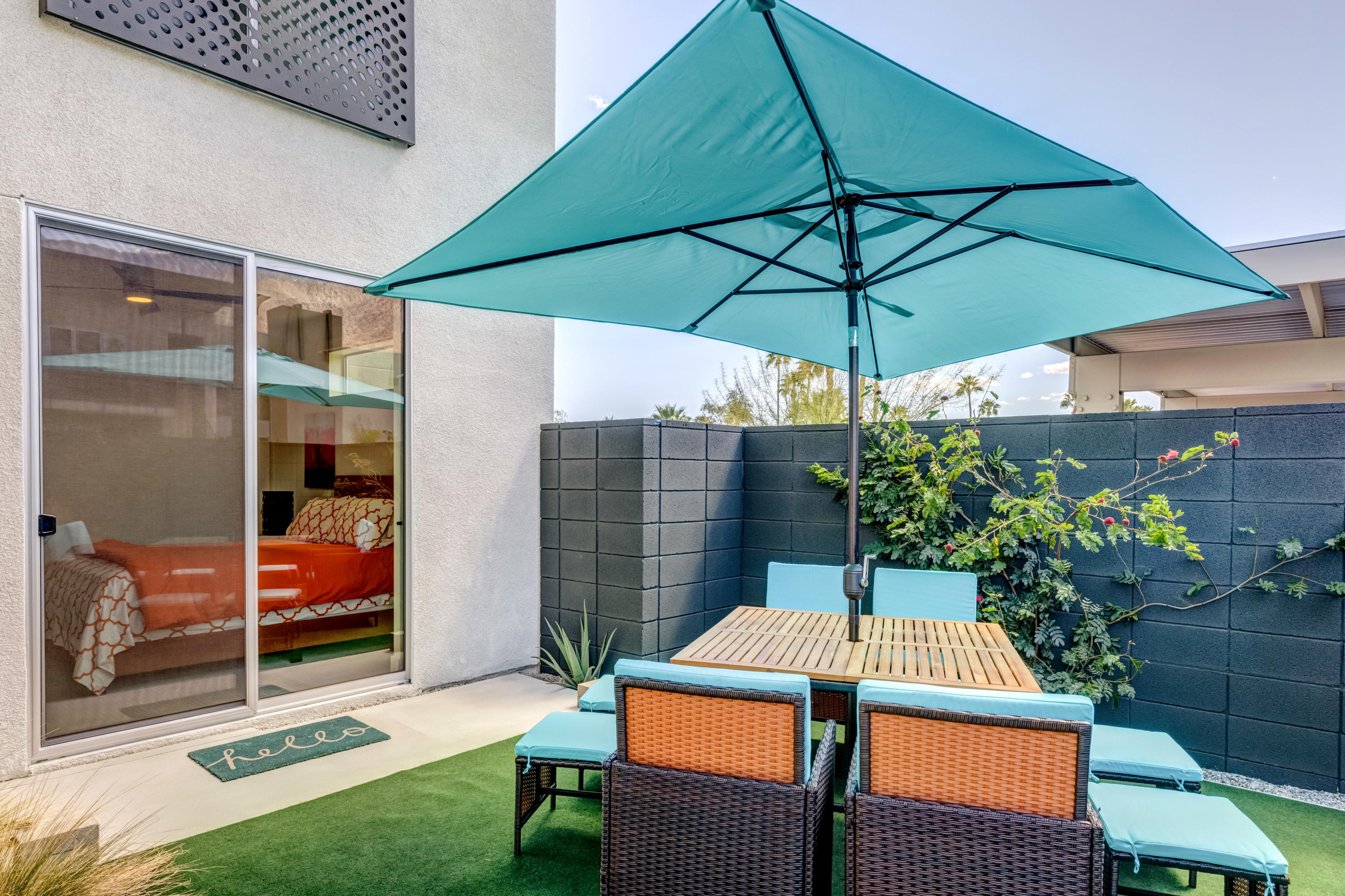 161 The River Palm Springs, CA 92262 - Photo 10 of 46 an outdoor space with furniture and umbrella