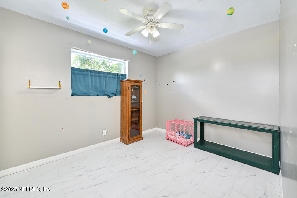 6408 Diane Road Jacksonville, FL 32277 - Photo 20 of 30 a view of a room with a flat screen tv