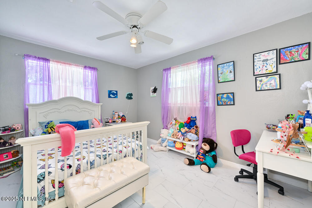 6408 Diane Road Jacksonville, FL 32277 - Photo 21 of 30 a bedroom with toys and a couch