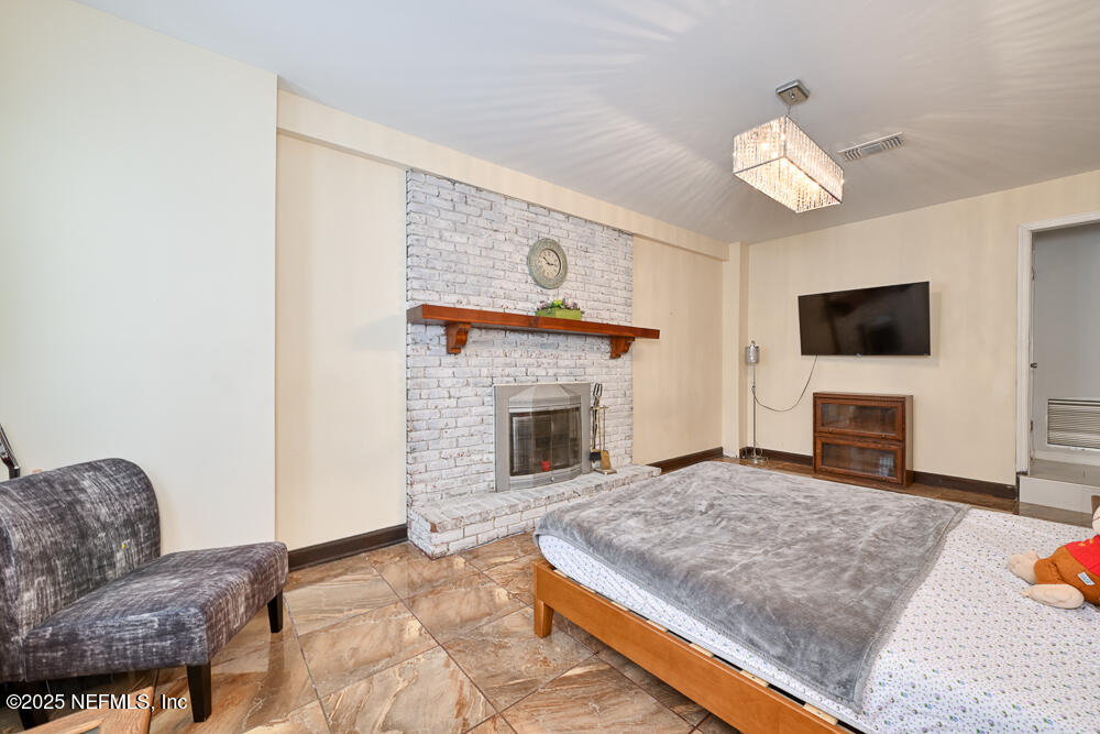 6408 Diane Road Jacksonville, FL 32277 - Photo 23 of 30 a living room with furniture and a fireplace