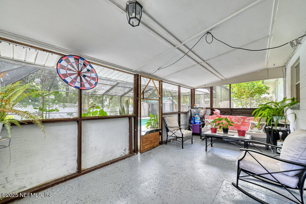 6408 Diane Road Jacksonville, FL 32277 - Photo 24 of 30 a living room with furniture and a floor to ceiling window