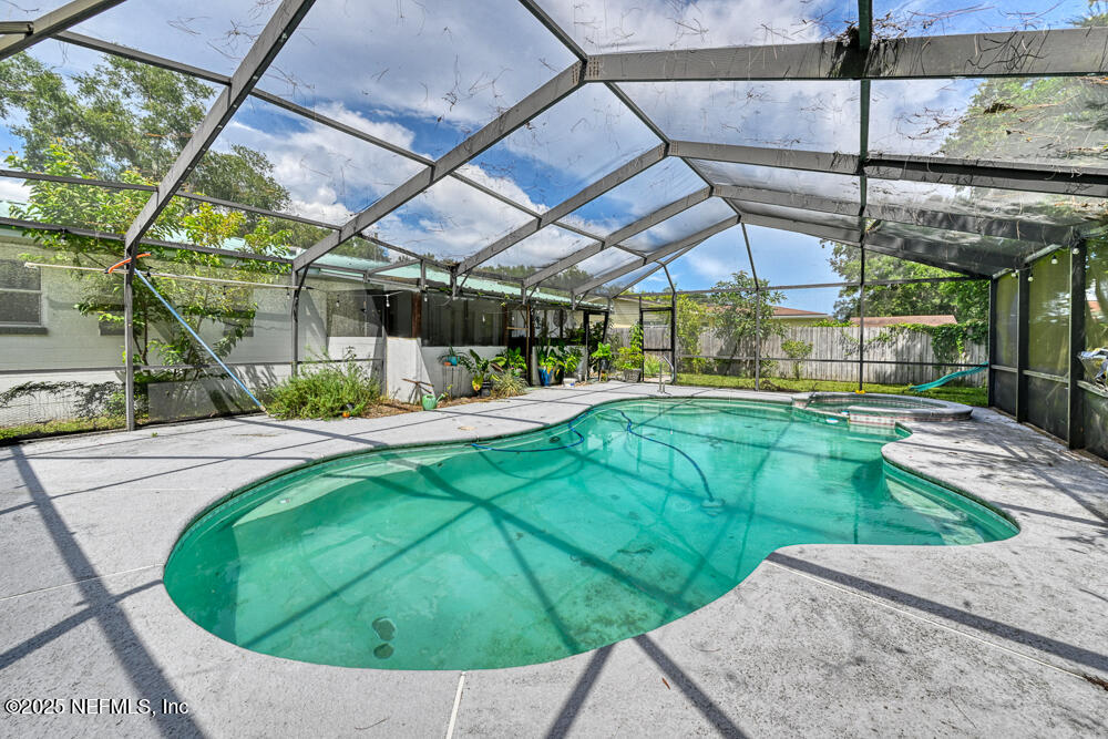 6408 Diane Road Jacksonville, FL 32277 - Photo 29 of 30 a view of a swimming pool with a patio