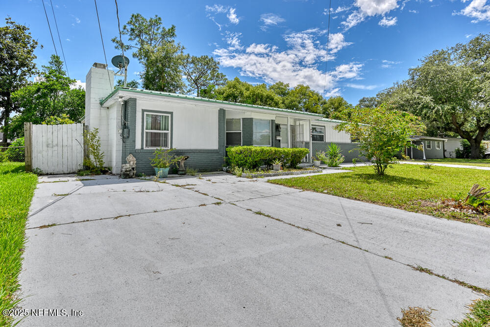 6408 Diane Road Jacksonville, FL 32277 - Photo 5 of 30 a view of a house with a yard