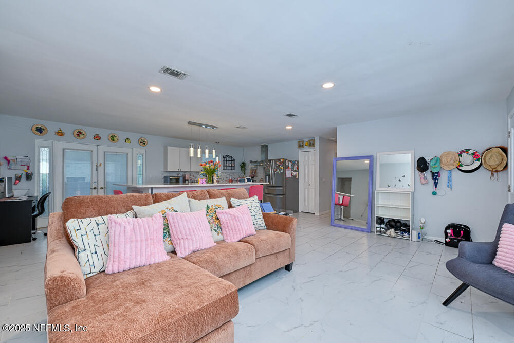 6408 Diane Road Jacksonville, FL 32277 - Photo 8 of 30 a living room with furniture and a couch