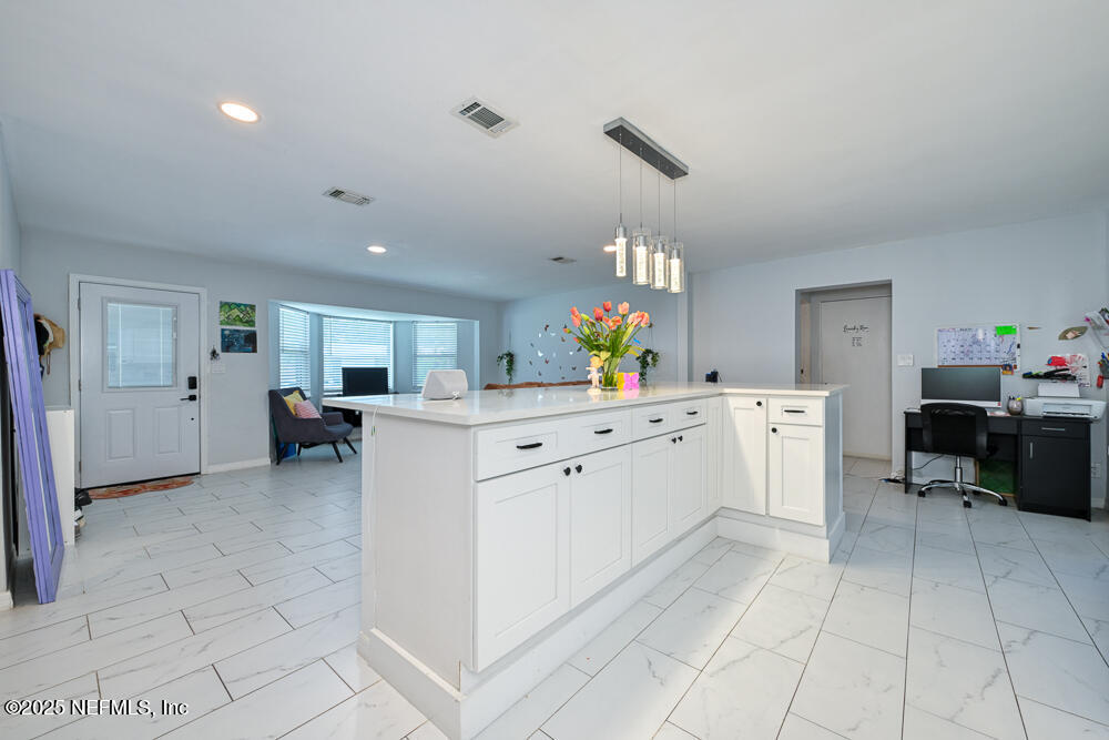 6408 Diane Road Jacksonville, FL 32277 - Photo 10 of 30 a kitchen with cabinets and furniture