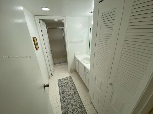 a bathroom with a sink and a shower