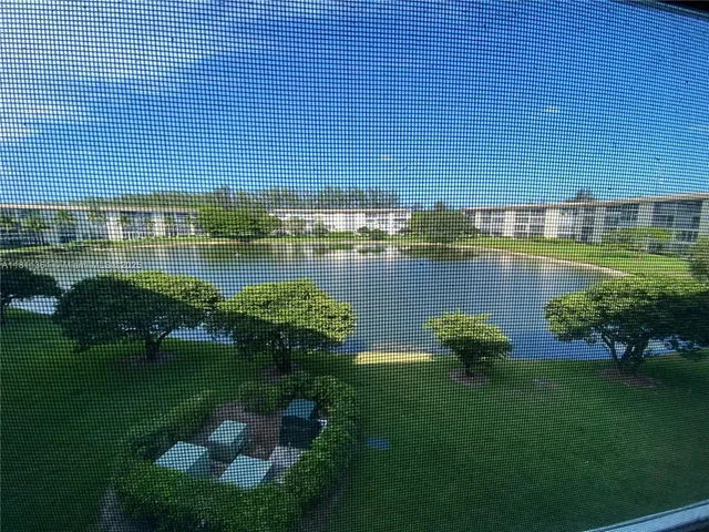 a view of a lake with a yard