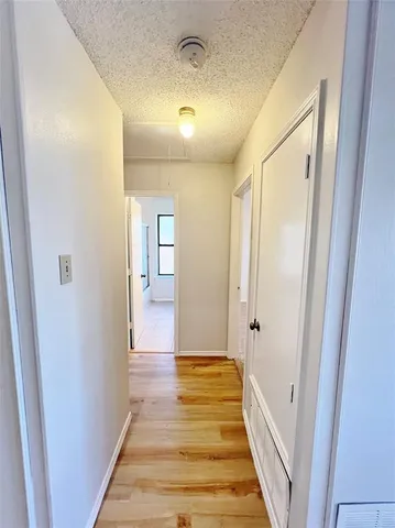 a view of a room with wooden floor and staircase
