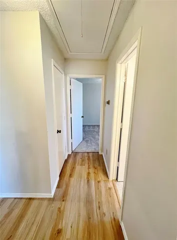 a bathroom with a granite countertop sink a mirror and a bathtub