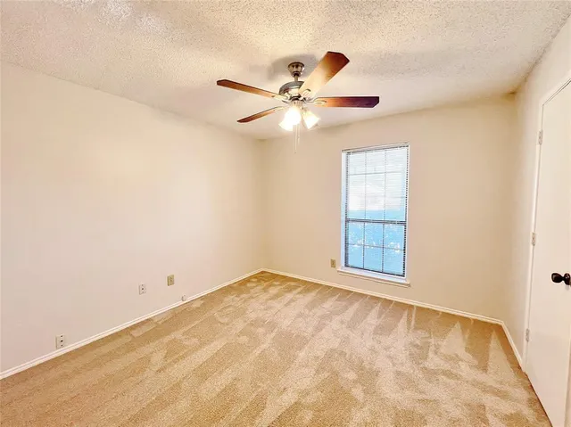 a view of a big room with carpet