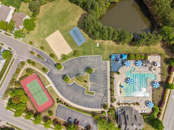 an aerial view of residential houses with outdoor space