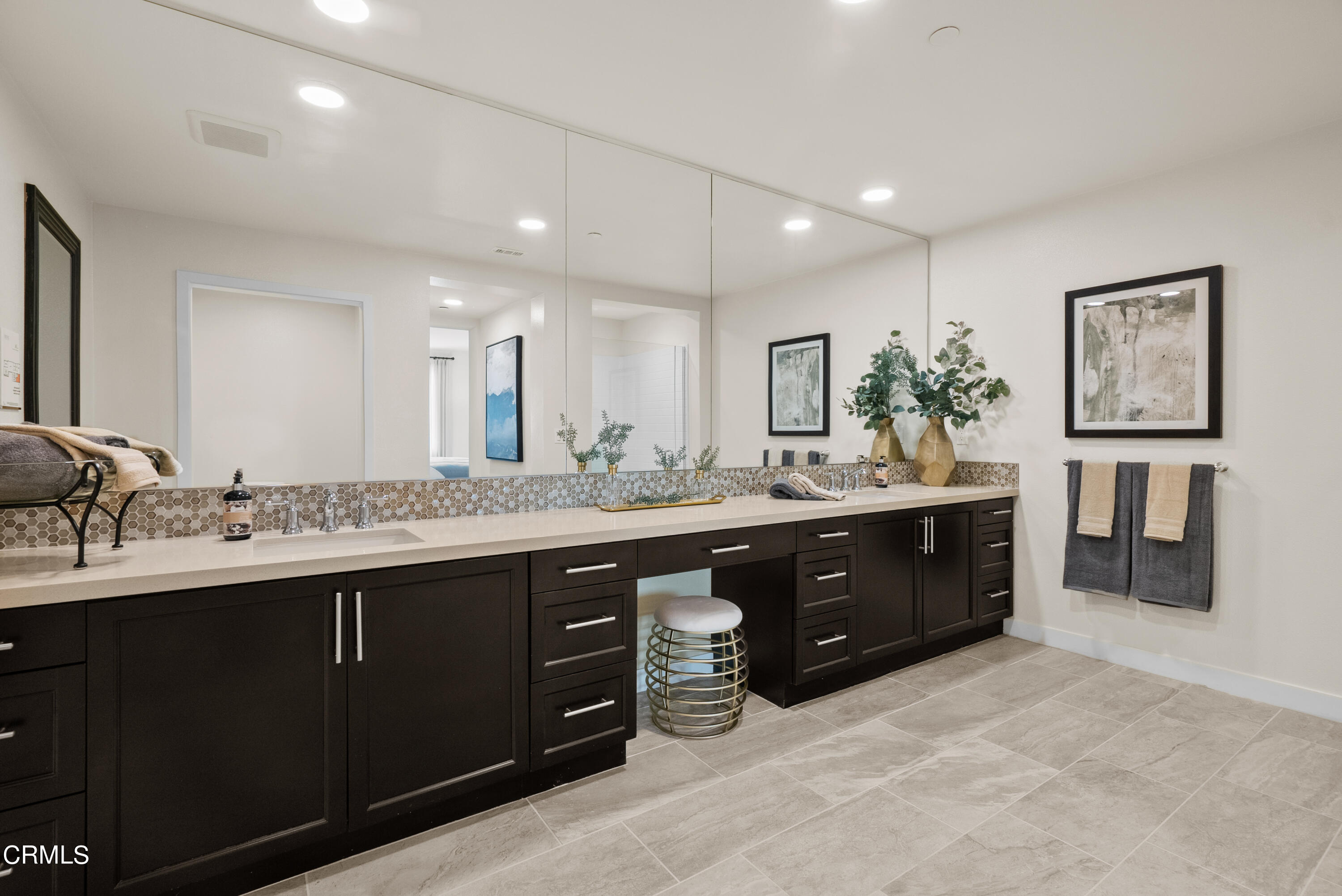 2870 Wagon Wheel Road, Unit 403 Oxnard, CA 93036 - Photo 14 of 19 a spacious bathroom with a double vanity sink and a mirror