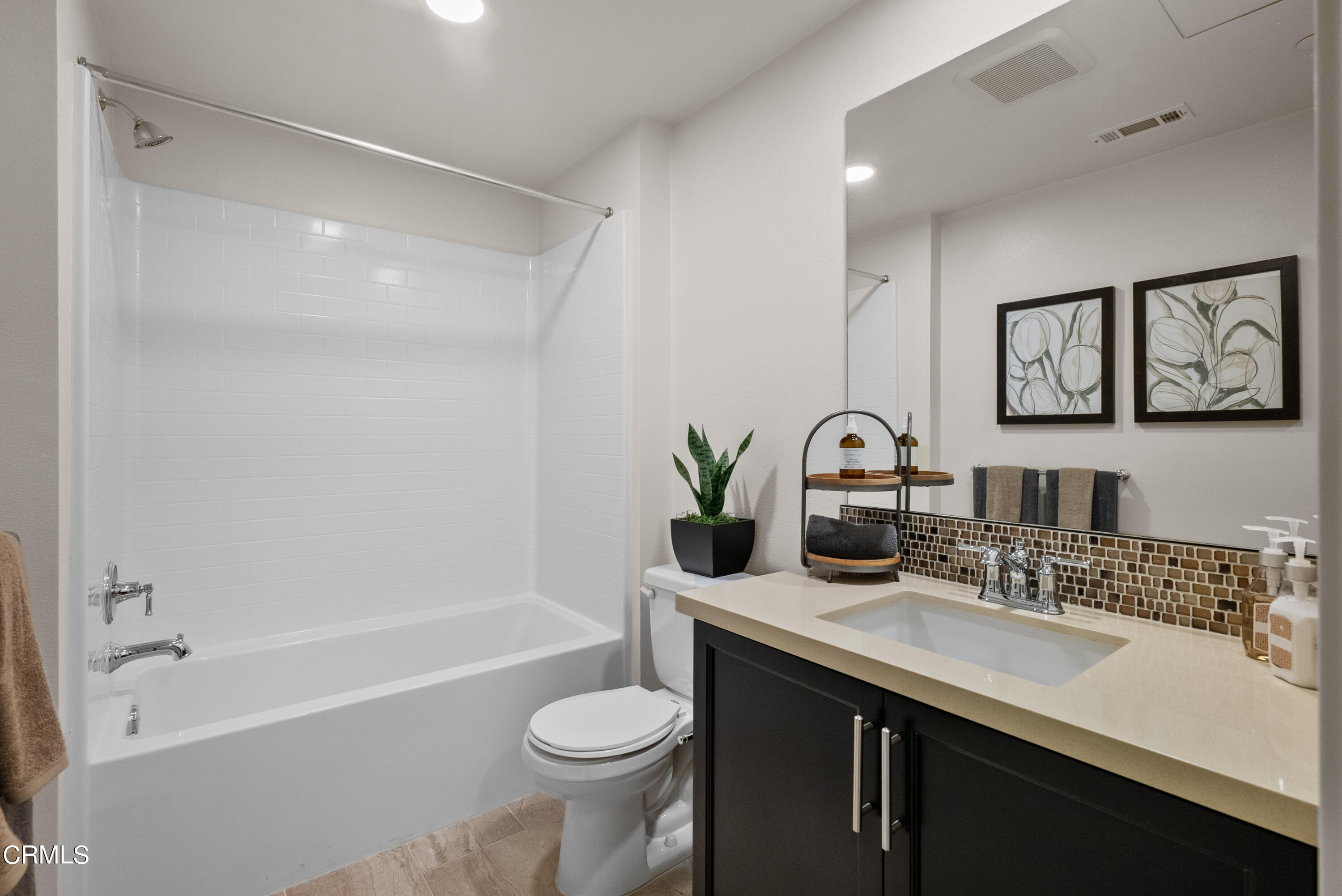 2870 Wagon Wheel Road, Unit 403 Oxnard, CA 93036 - Photo 17 of 19 a bathroom with a granite countertop sink toilet and shower