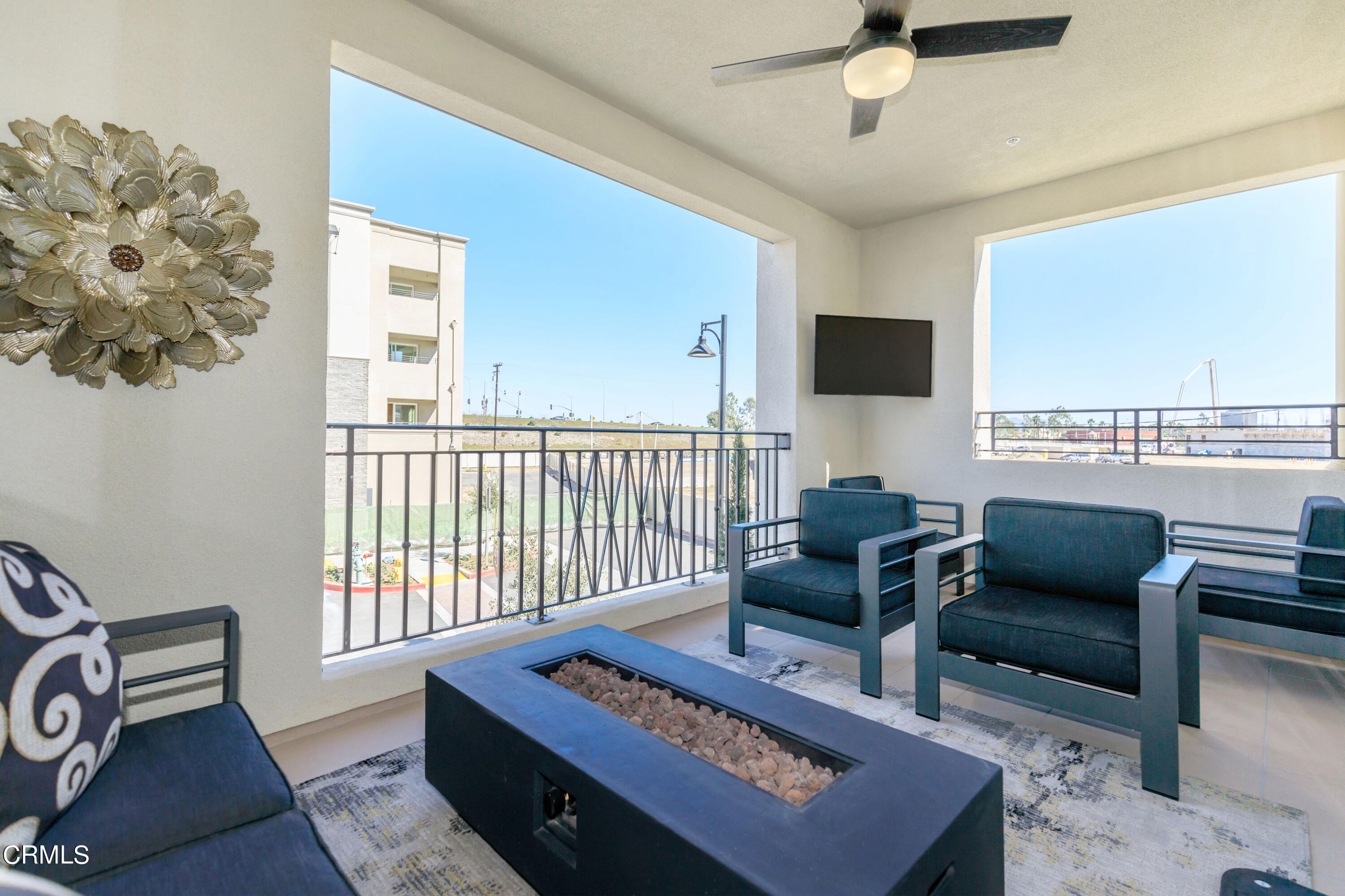 2870 Wagon Wheel Road, Unit 403 Oxnard, CA 93036 - Photo 10 of 19 a living room with furniture and a flat screen tv