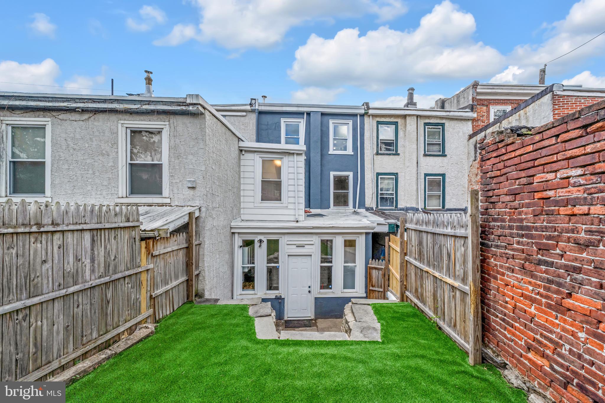 4413 Baker Street Philadelphia, PA 19127 - Photo 11 of 30 a front view of a house with a yard