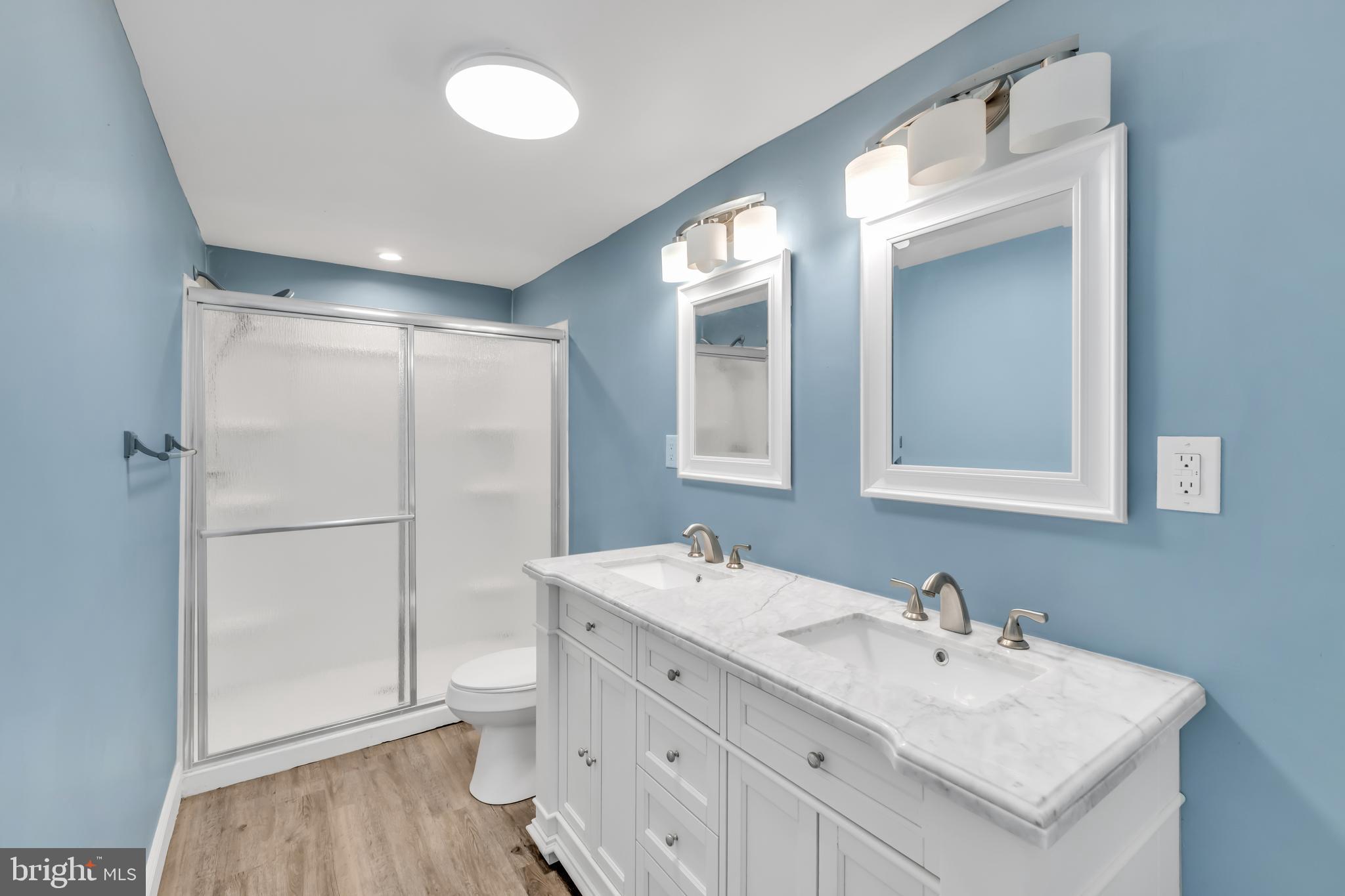 4413 Baker Street Philadelphia, PA 19127 - Photo 21 of 30 a bathroom with a sink toilet and mirror