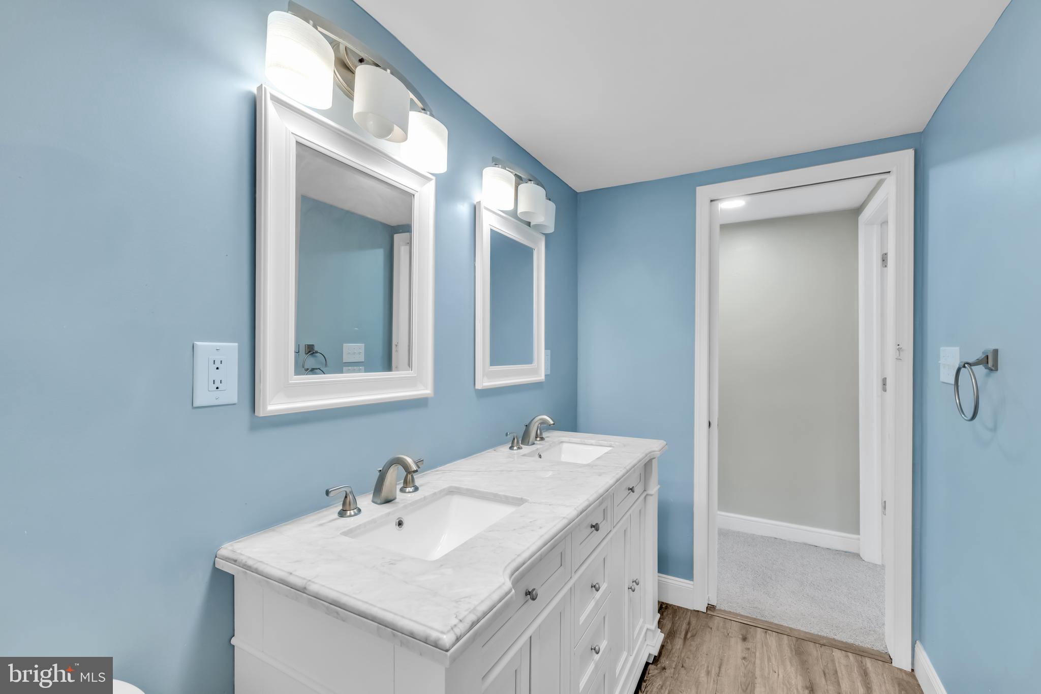 4413 Baker Street Philadelphia, PA 19127 - Photo 22 of 30 a bathroom with a sink a mirror and a vanity