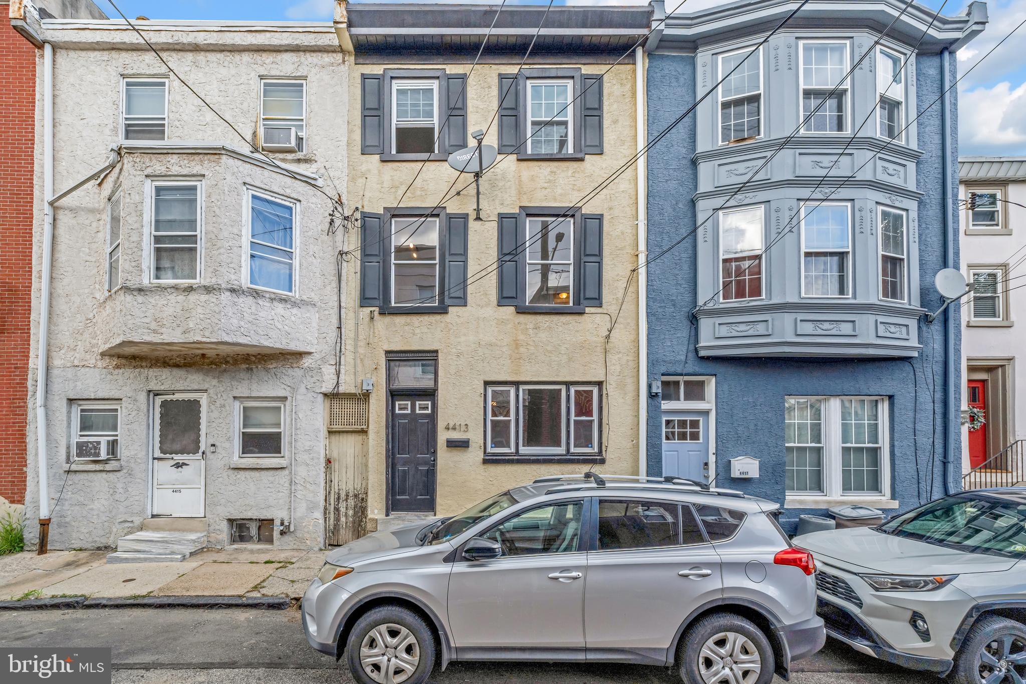 4413 Baker Street Philadelphia, PA 19127 - Photo 8 of 30 a front view of a residential apartment building with a yard
