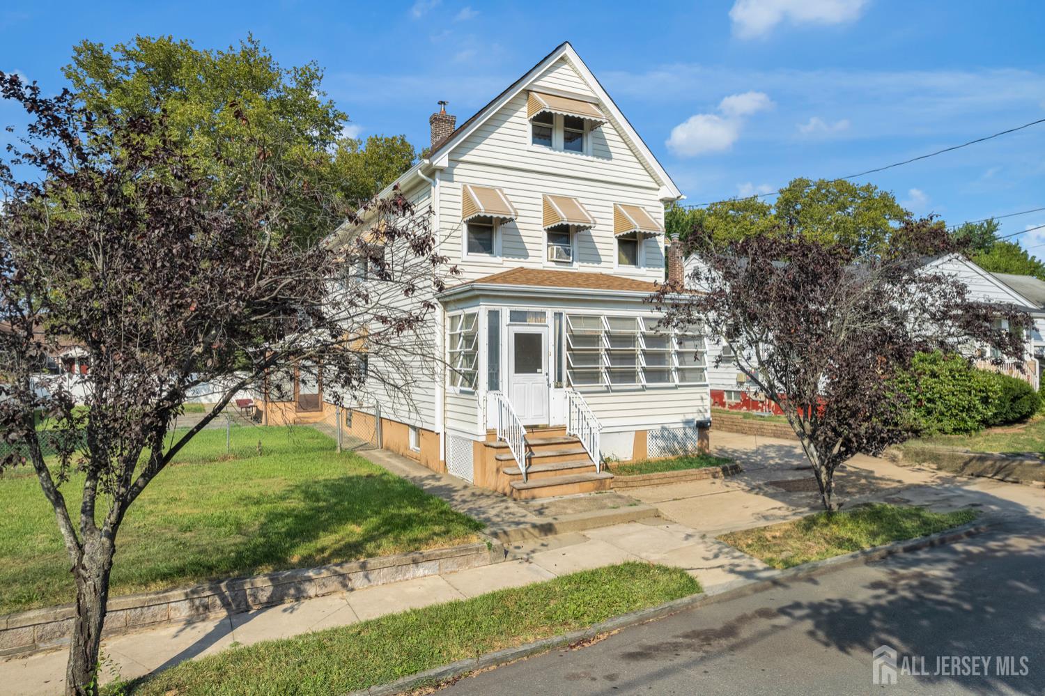 25 Rutgers Street New Brunswick, NJ 08901 - Photo 2 of 3 a front view of a house with a yard