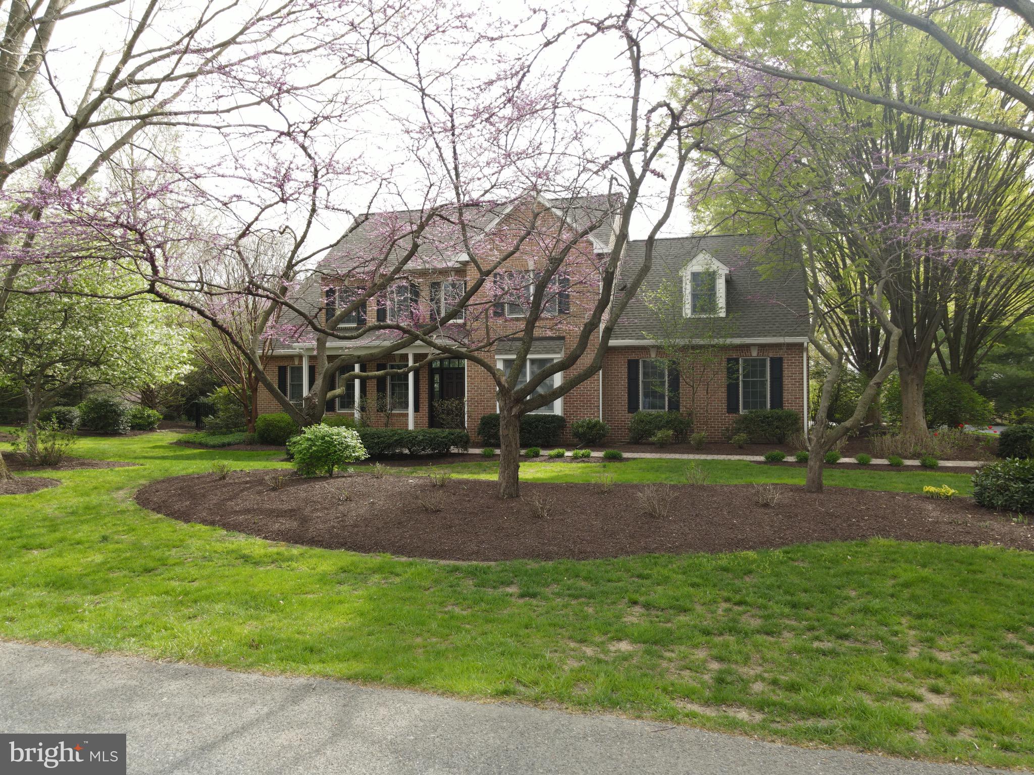 Formal front house front with flower beds