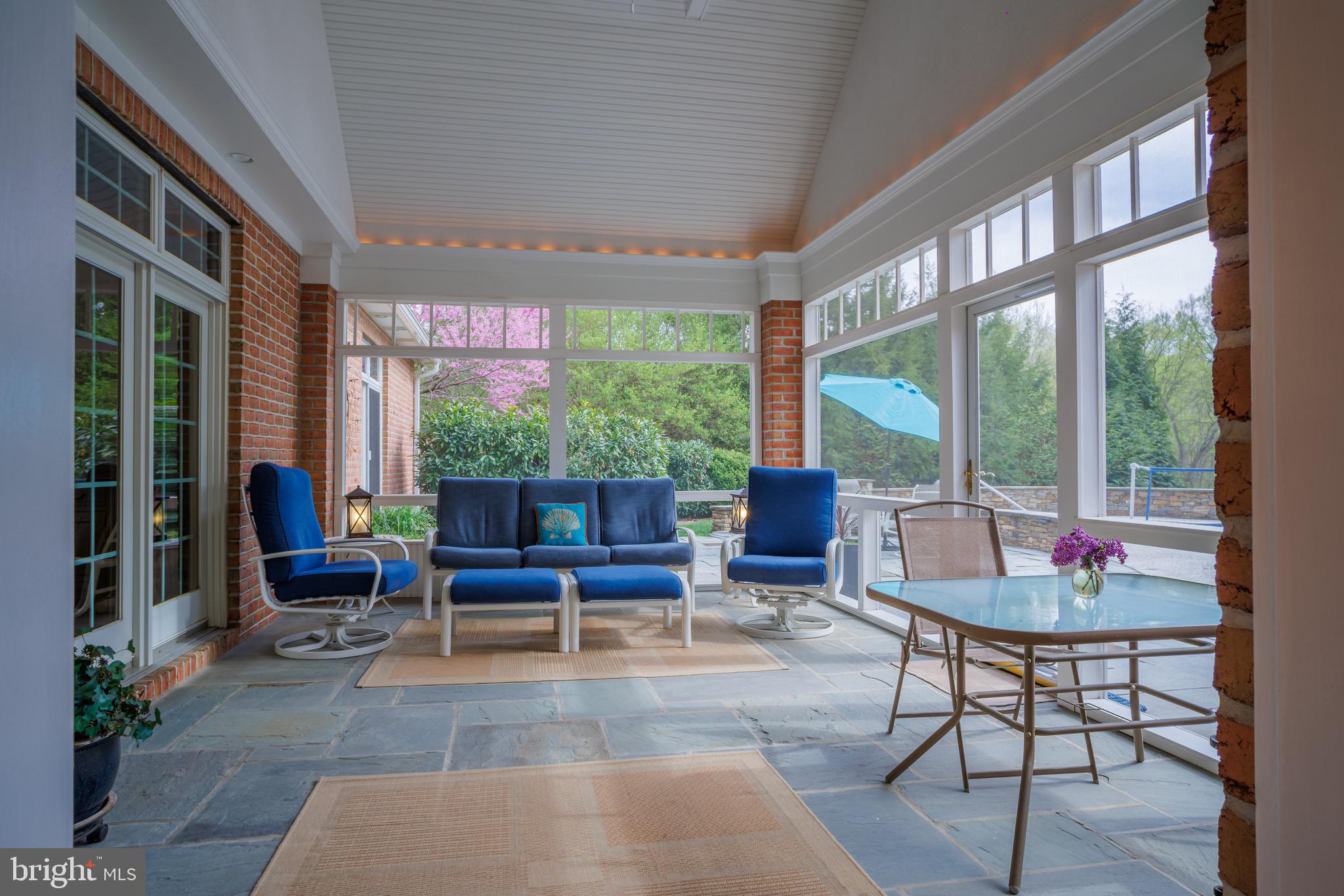 18 Deerfield Road Lancaster, PA 17603 - Photo 21 of 31 Screened porch between living room and pool patio