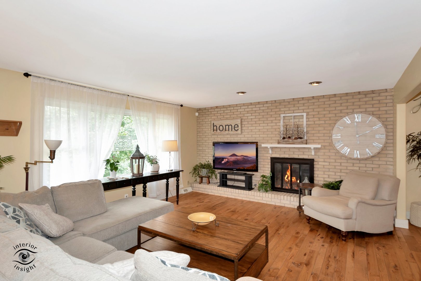 905 Southgate Road New Lenox, IL 60451 - Photo 3 of 40 a living room with furniture a fireplace and a flat screen tv
