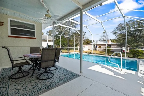 a view of a chairs and table in the patio