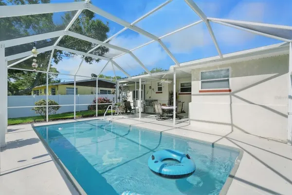 a view of a swimming pool with a patio