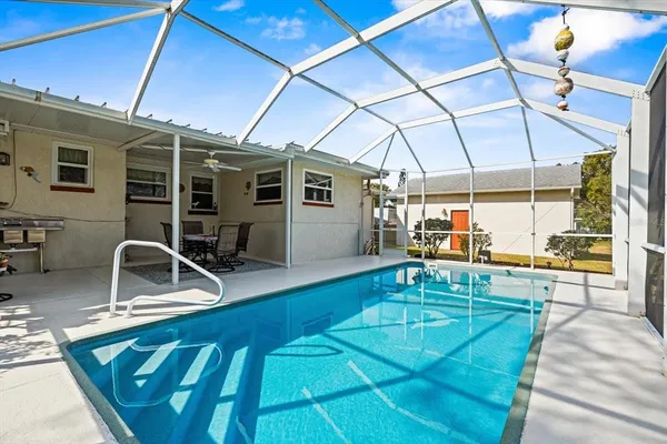 a view of a swimming pool with a patio
